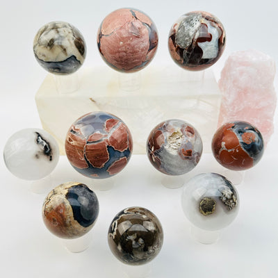 multiple volcanic agate spheres displayed to show the differences in the sizes and color shades 