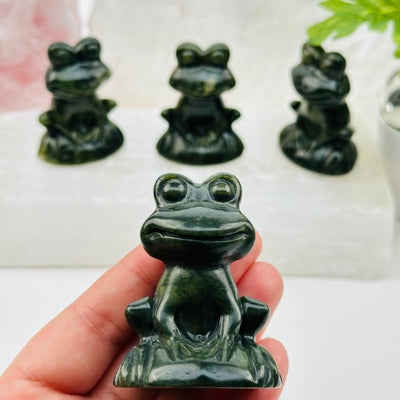 jadeite crystal frog in hand for size reference
