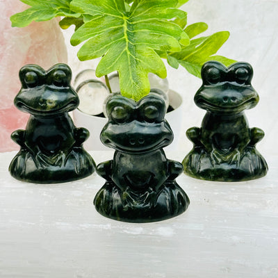 jadeite crystal frogs displayed as home decor 