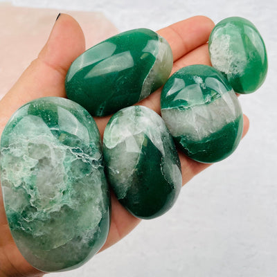 palm stones displayed in hand for size reference 