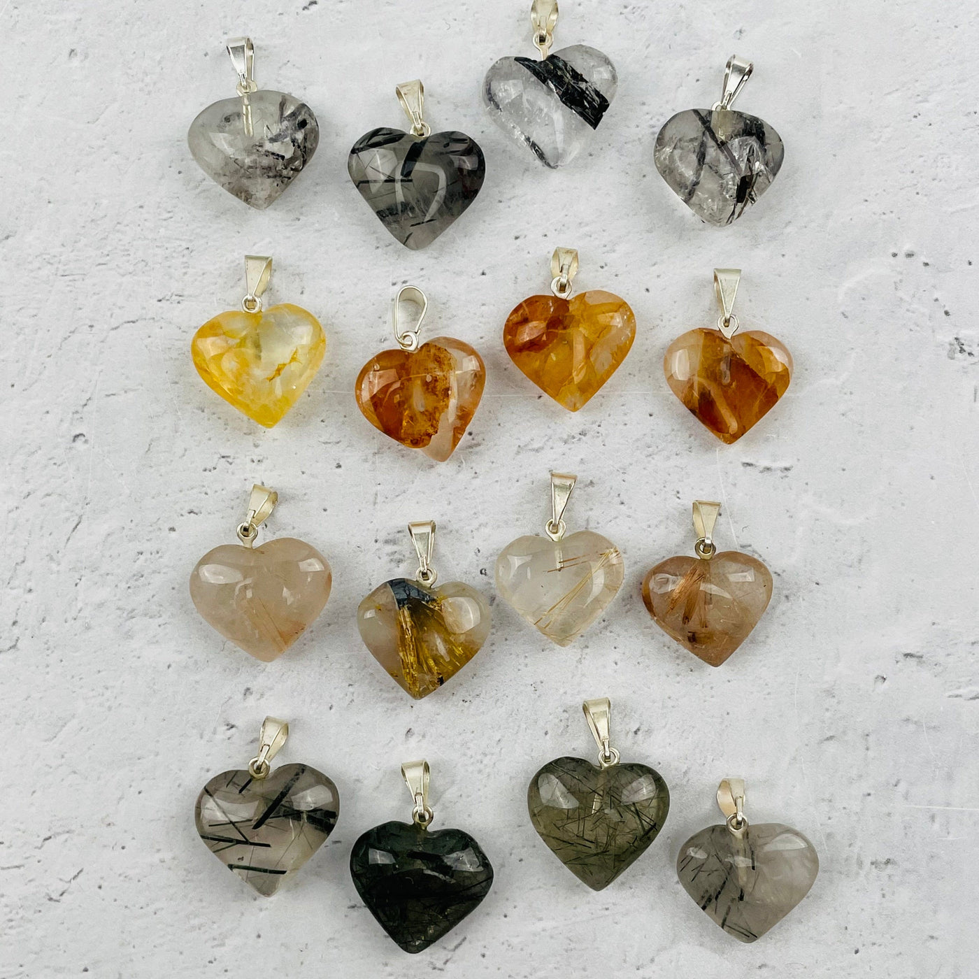 multiple pendants displayed to show the differences in the crystal types 
