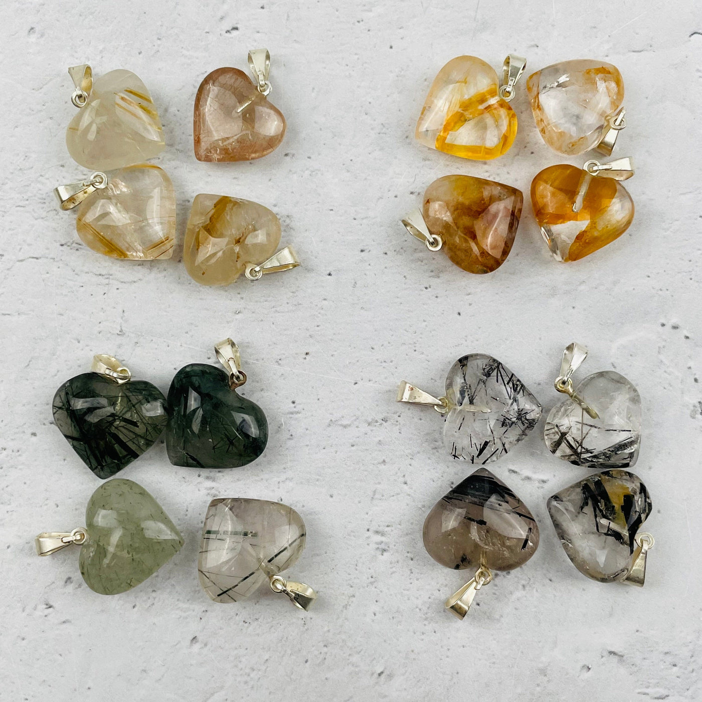 multiple pendants displayed to show the differences in the crystal types
