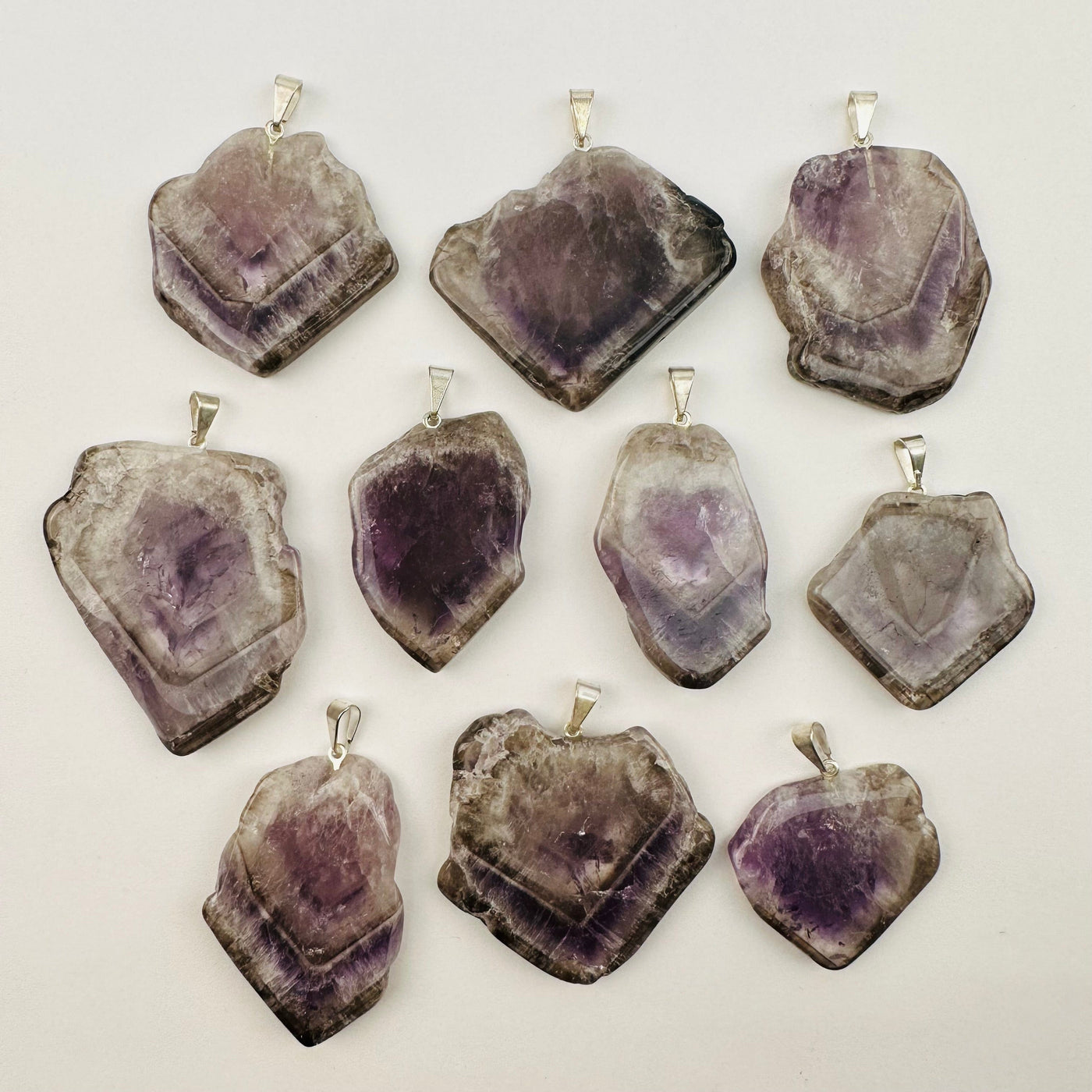 multiple pendants displayed to show the differences in the sizes and color shades 