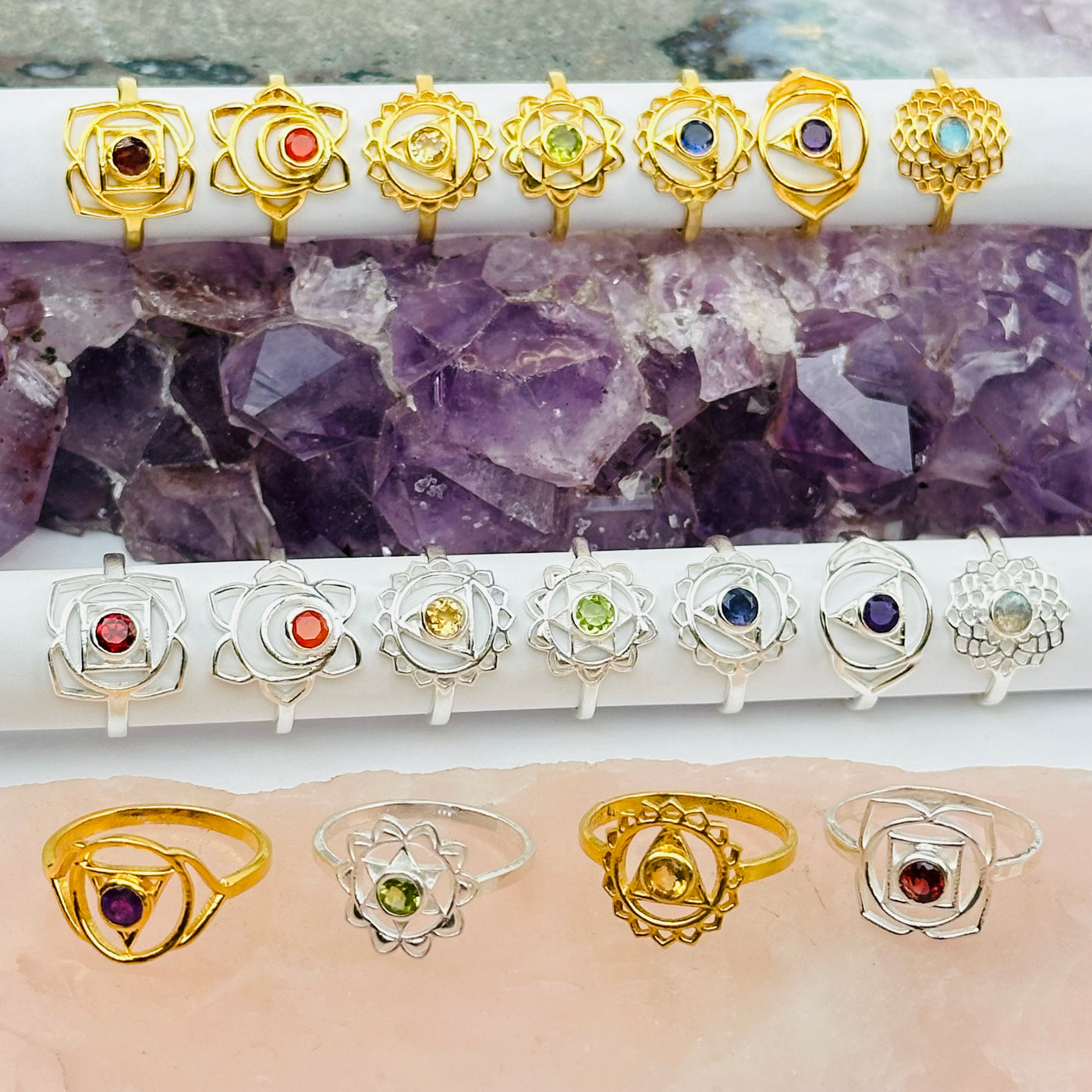 gold and silver chakra rings displayed to show the differences in the gemstones