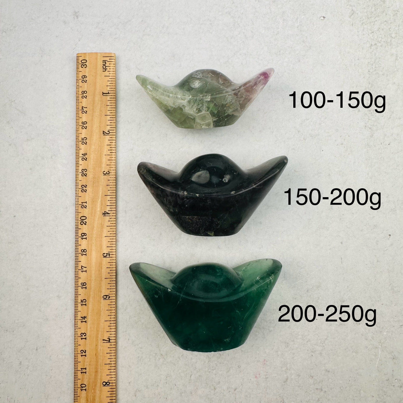 Rainbow Fluorite Yuanbao Crystal - Money Stone - By Weight - next to a ruler for size reference 