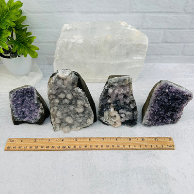 multiple cut base crystals displayed to show the differences in the sizes and color shades 