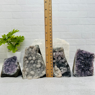 Natural Amethyst Druzy Cut Base next to a ruler for size reference 