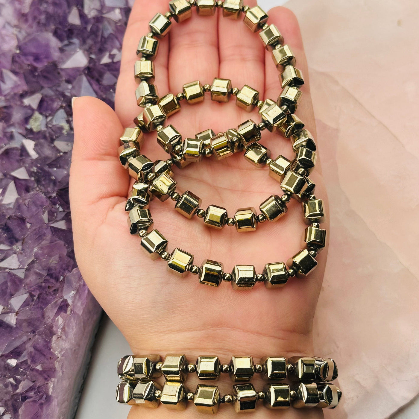 Pyrite Cube Bead Bracelets in hand for size reference 