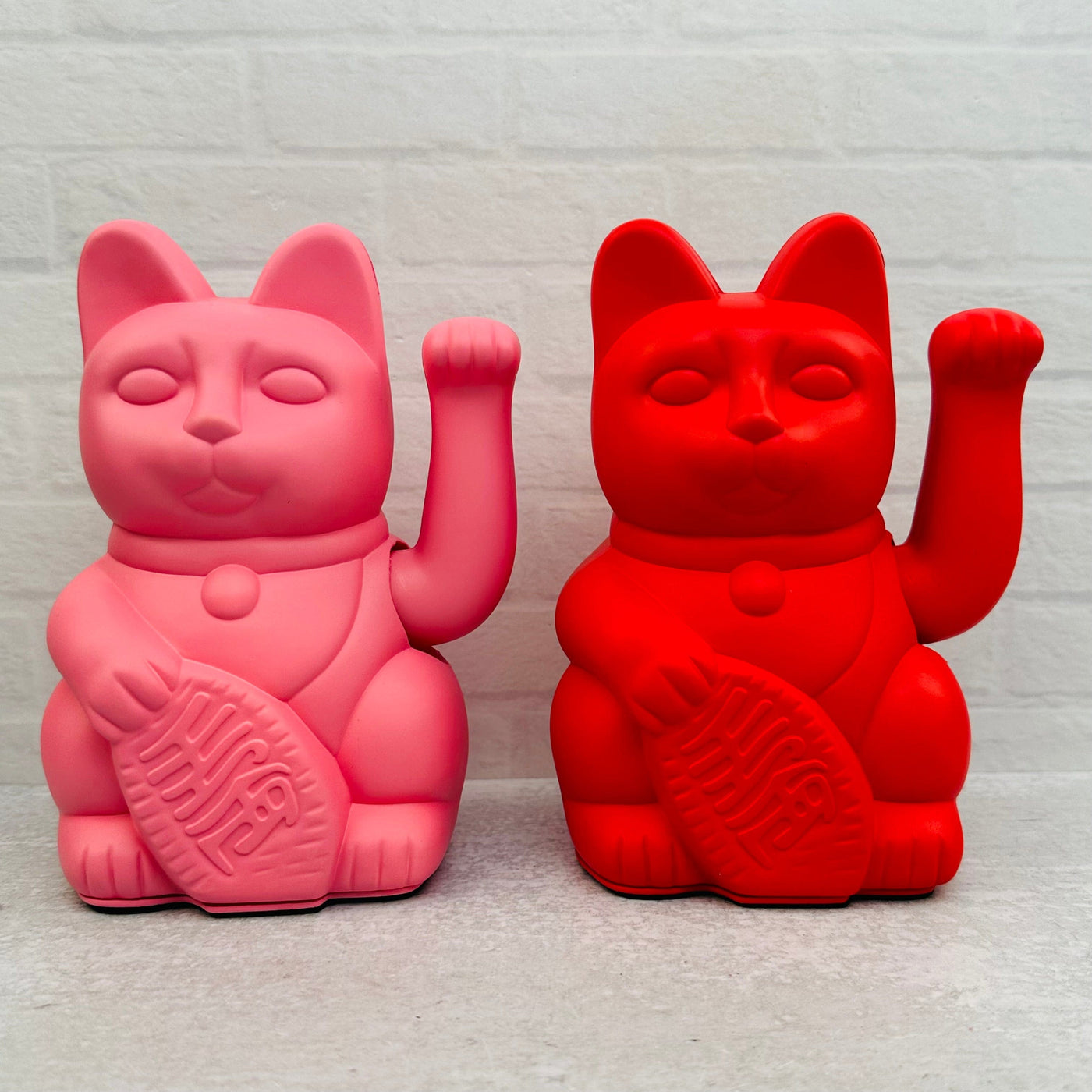 cats available in pink and red 