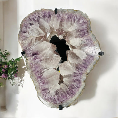 amethyst cluster mirror on wall as home decor 