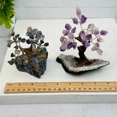 gemstone trees next to a ruler for size reference