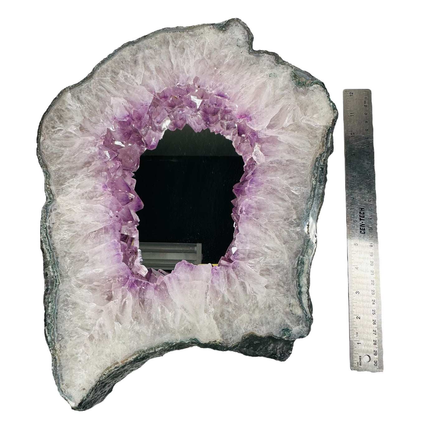 amethyst cluster mirror next to a ruler for size reference 