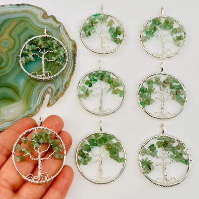 tree of life green aventurine crystal pendant on hand for size reference 