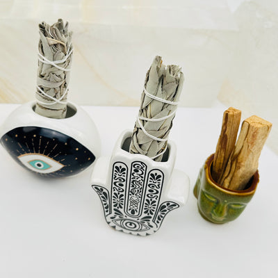 ceramic smudge holders displayed as home decor 