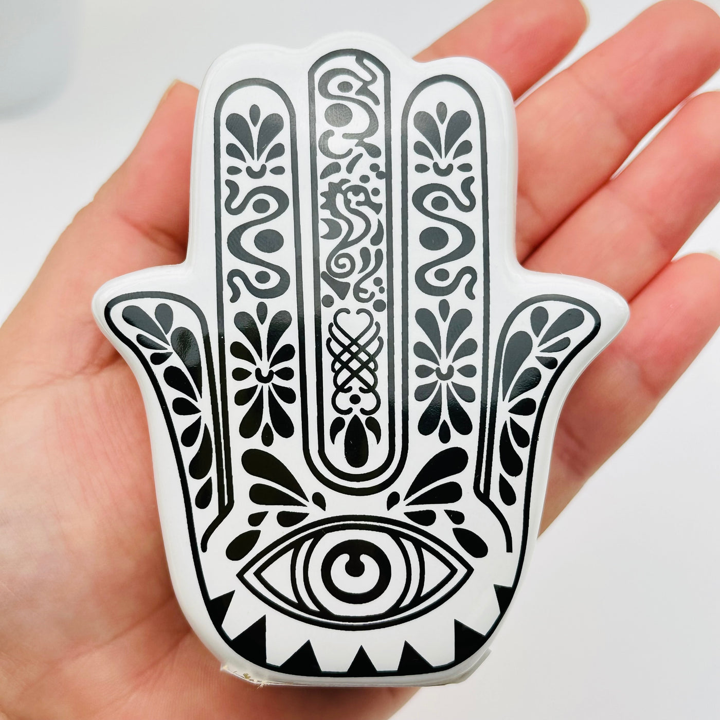 hamsa hand holder on hand for size reference 