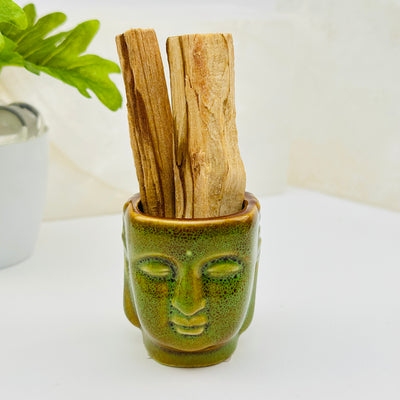 buddha head holder displayed as home decor 