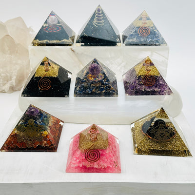 orgone pyramids filled with different crystals 