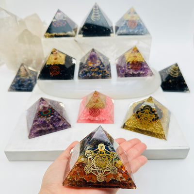 chakra orgone pyramid on hand for size reference