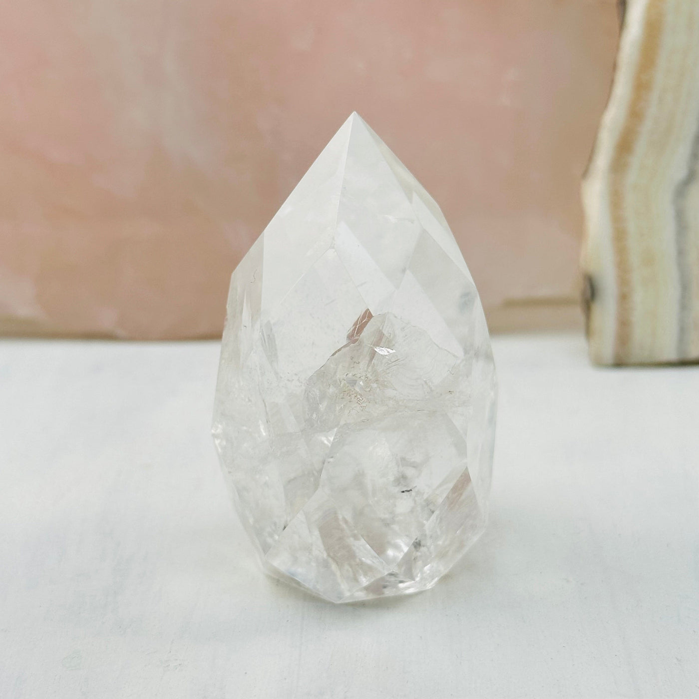 Faceted Clear Quartz Crystal Egg Point displayed as home decor 
