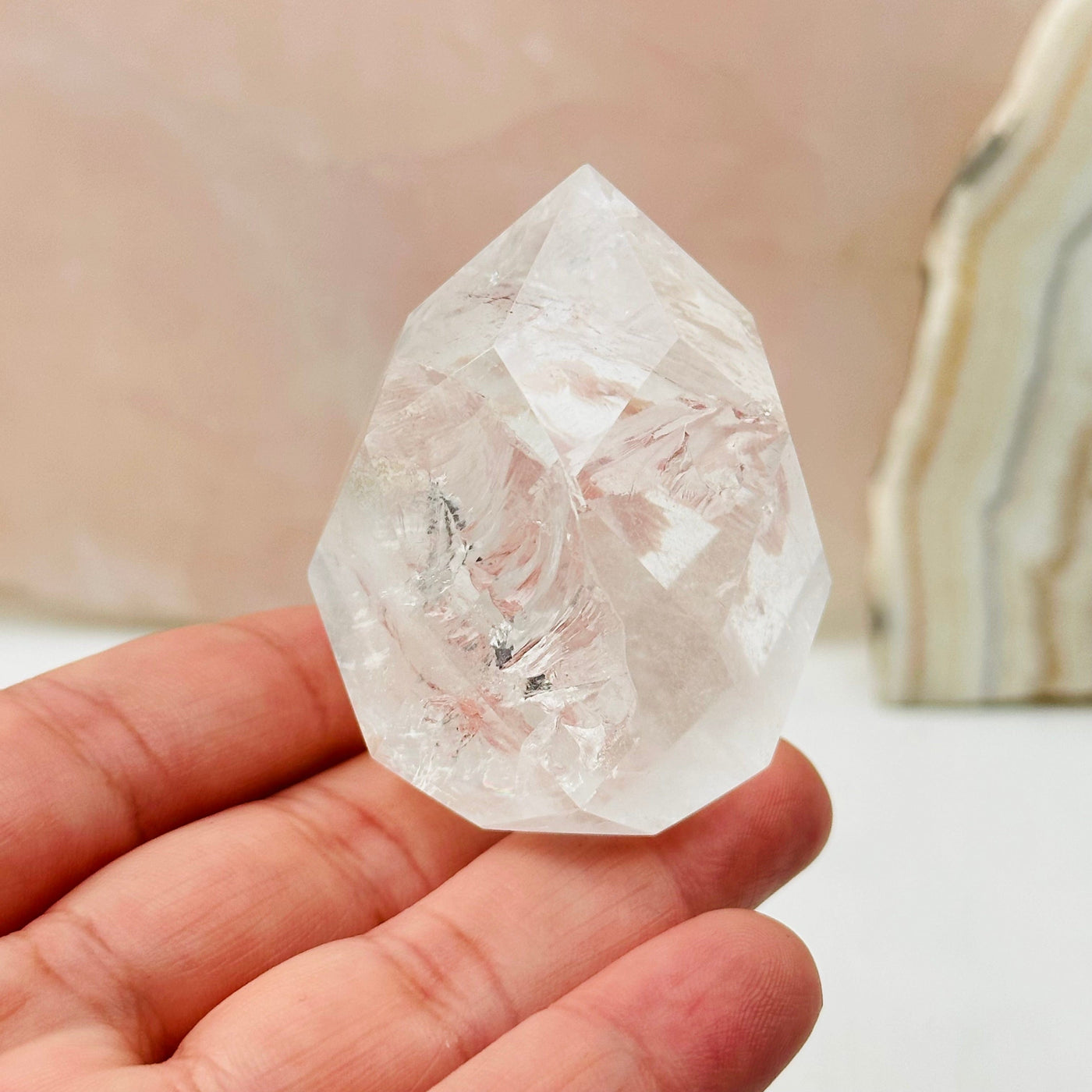 Faceted Clear Quartz Crystal Egg Point in hand for size reference 
