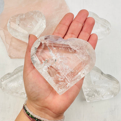 Faceted Crystal Quartz Heart in hand for size reference 