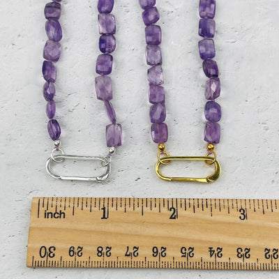 necklace bail next to a ruler for size reference 