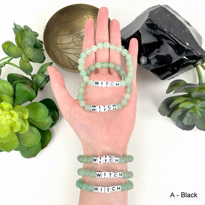 Aventurine Crystal Mala Bead Bracelet - WITCH Letter Beads on a wrist and in a hand