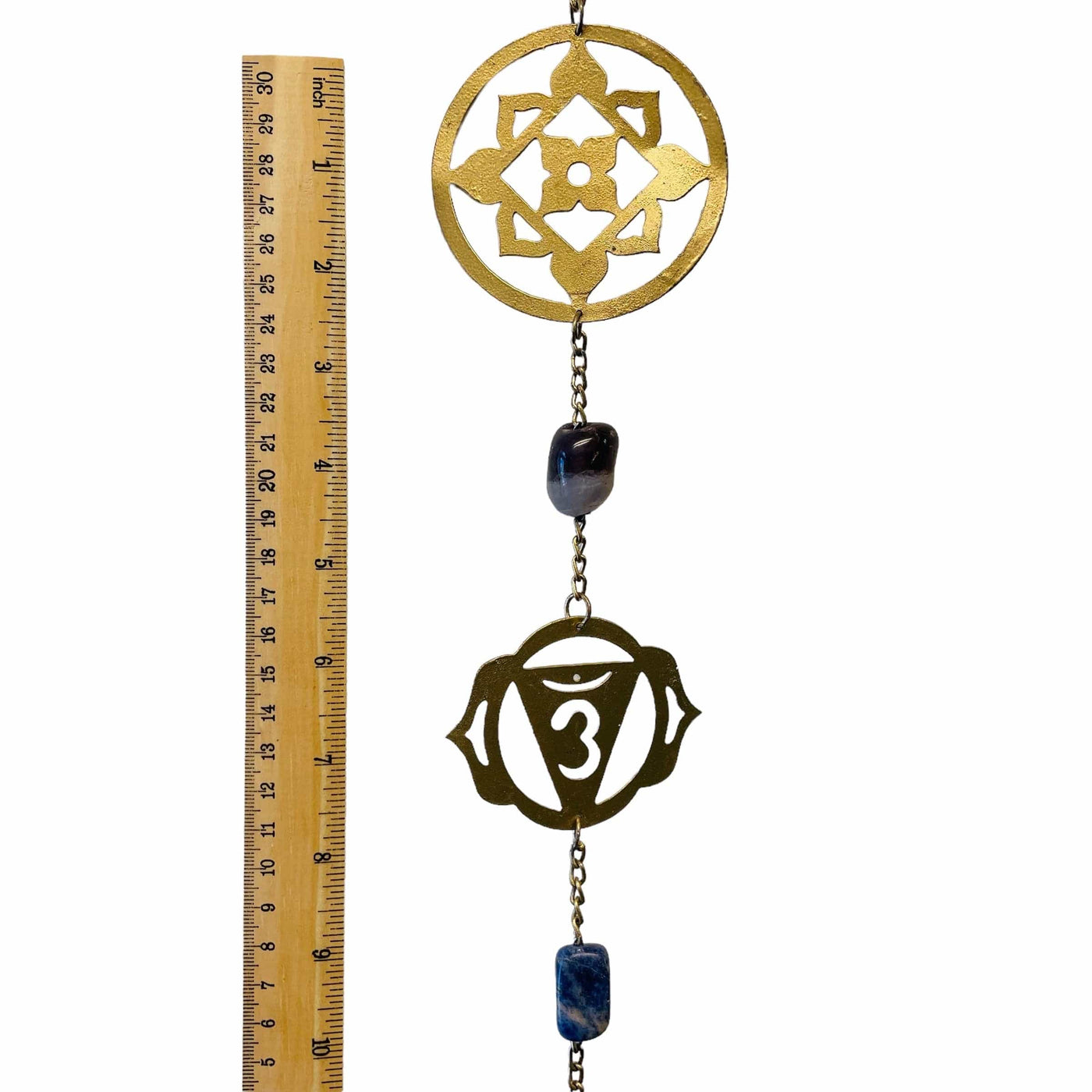 chakra symbols next to a ruler for size reference 
