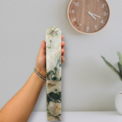 Moss Agate Polished Obelisk in hand for size reference 
