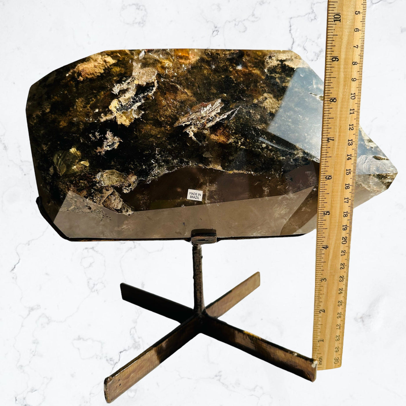 Large Lodolite Crystal Quartz on Metal Stand next to a ruler for size reference 