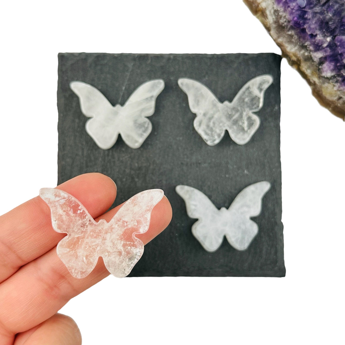 crystal quartz butterfly cabochon in hand for size reference 