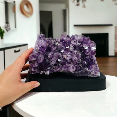 Amethyst Crystal Cluster on Wooden Base - Table Setting - next to hand for size reference 