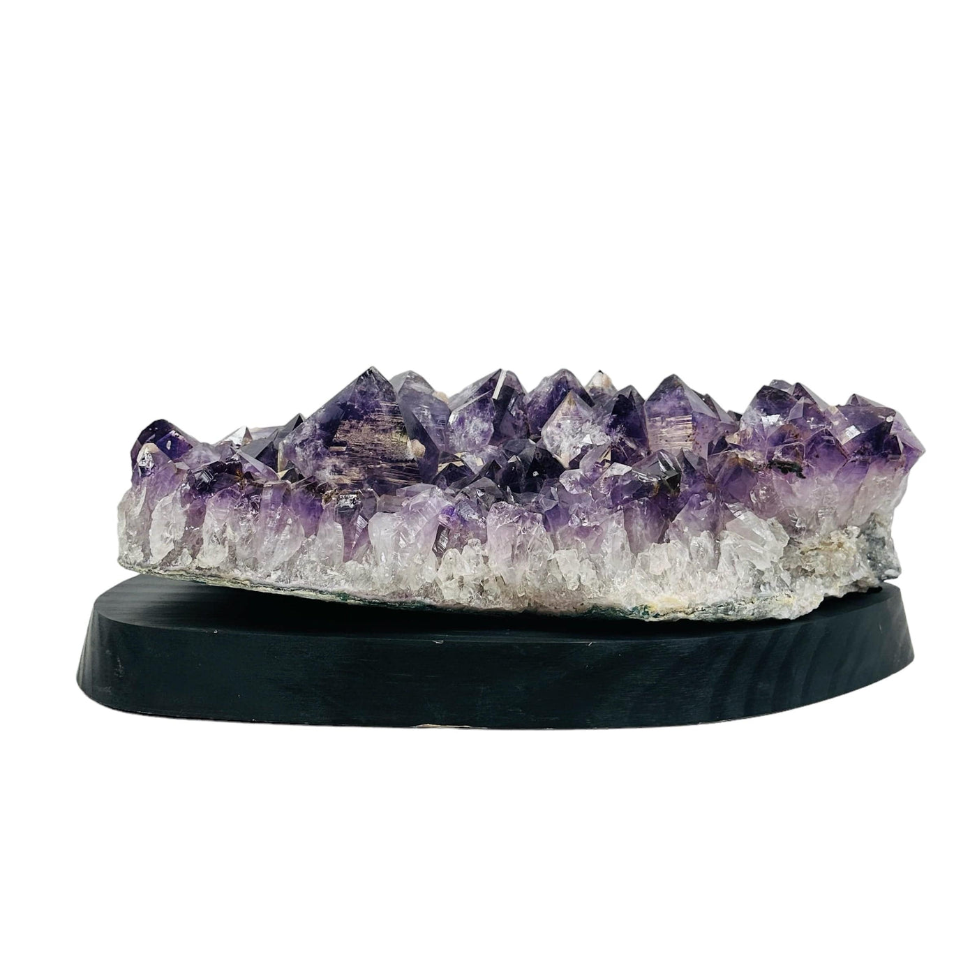 back side of the large amethyst on wooden stand 
