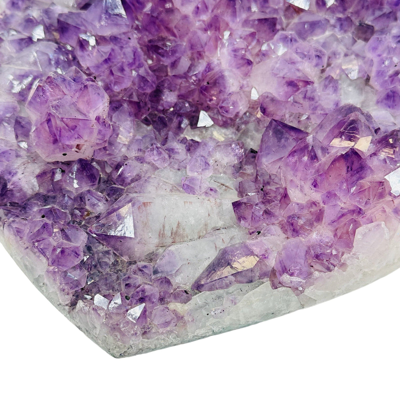 close up of some amethyst clusters on this heart 