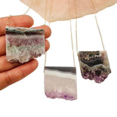 Amethyst Slice Necklace in hand for size reference 