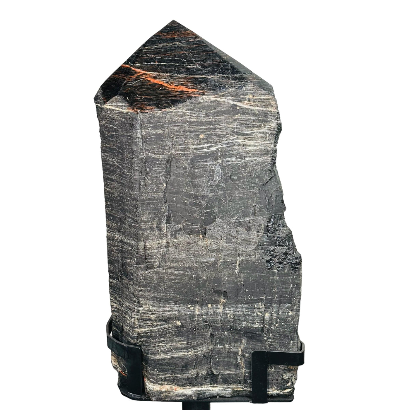 close up of large black tourmaline on stand.