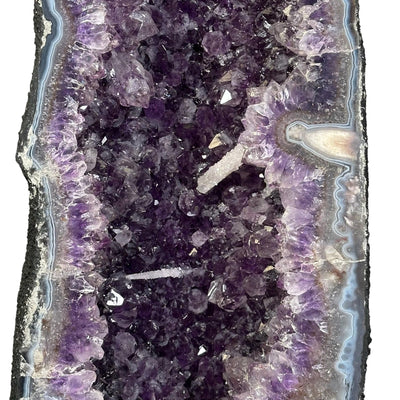 close up of the calcite druzy formations growing off the amethyst