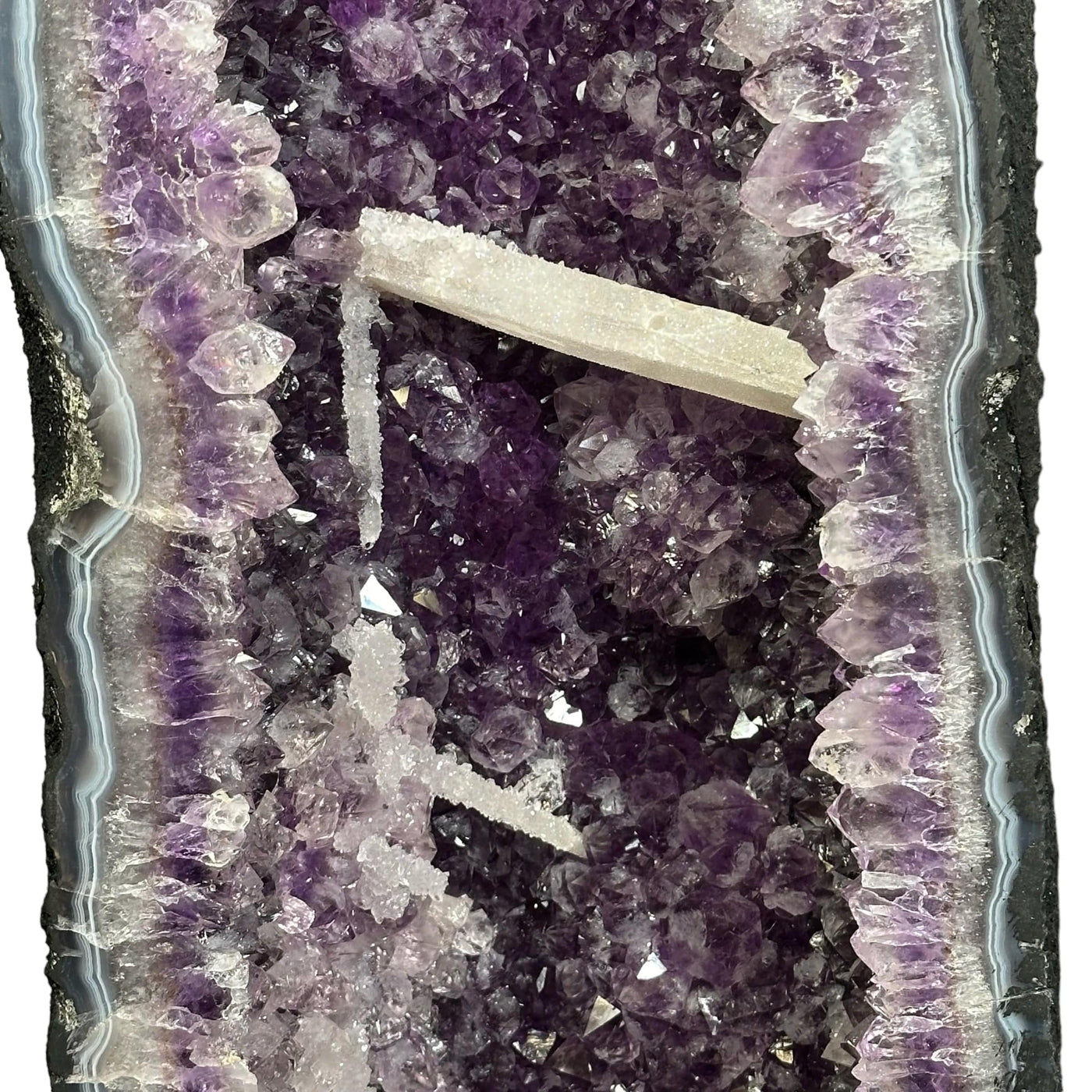 close up of the calcite druzy formations growing off the amethyst