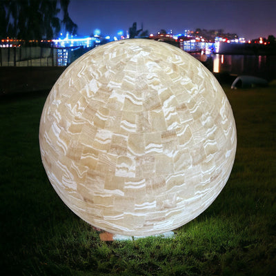 Huge Mexican Onyx Sphere Lamp displayed as yard decor