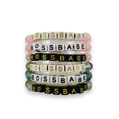 Boss Babe word bracelets stacked up showing the assorted stone and color of print available