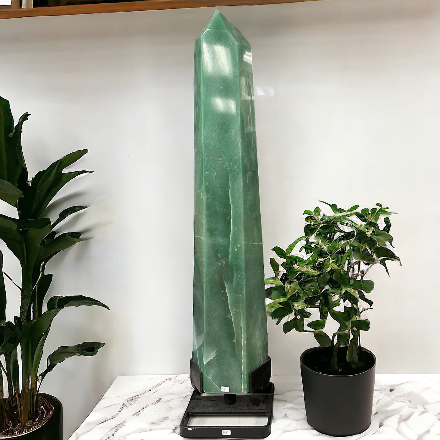 Large Green Quartz Points on Metal Stand displayed as home decor 