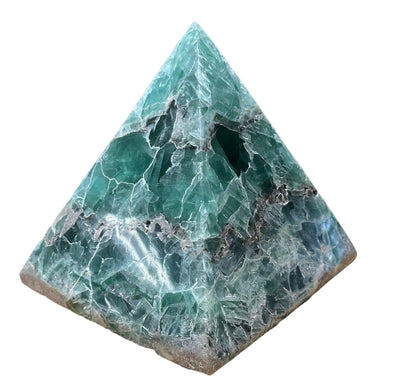large green fluorite pyramid on a white background.