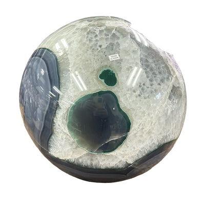 close up of the bottom of the sphere showing nice green agate banding