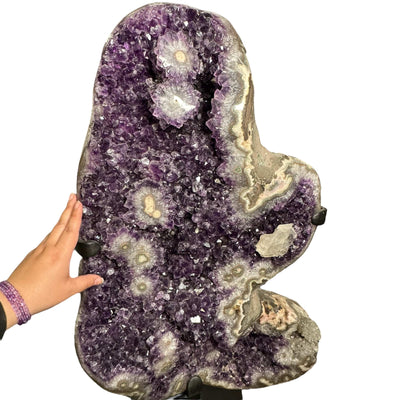 hand near the amethyst cluster for size reference 