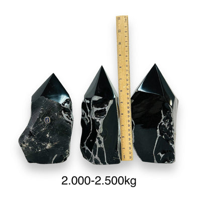 Black Obsidian Crystal Semi Polished Points - By Weight - next to a ruler for size reference