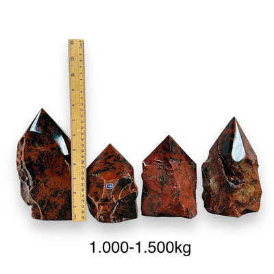 Mahogany Obsidian Crystal Semi Polished Cut Base - By weight - next to a ruler for size reference 