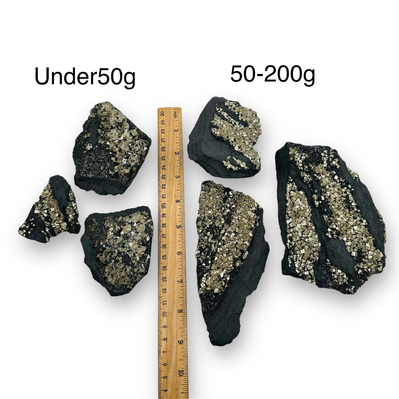 Pyrite on Basalt Matrix sold by weight next to a ruler for size reference 