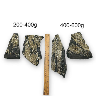 Pyrite on Basalt Matrix sold by weight next to a ruler for size reference