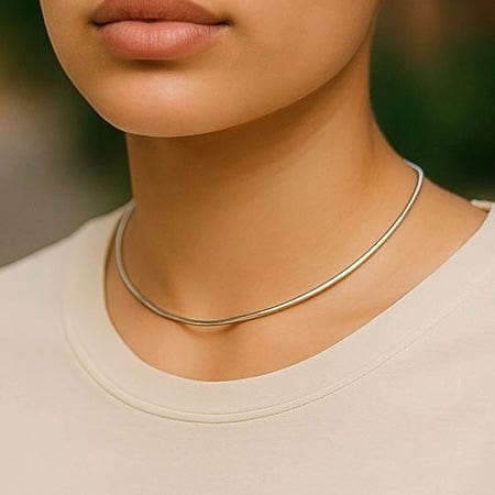 thin brass choker necklace on model to show how it fits  