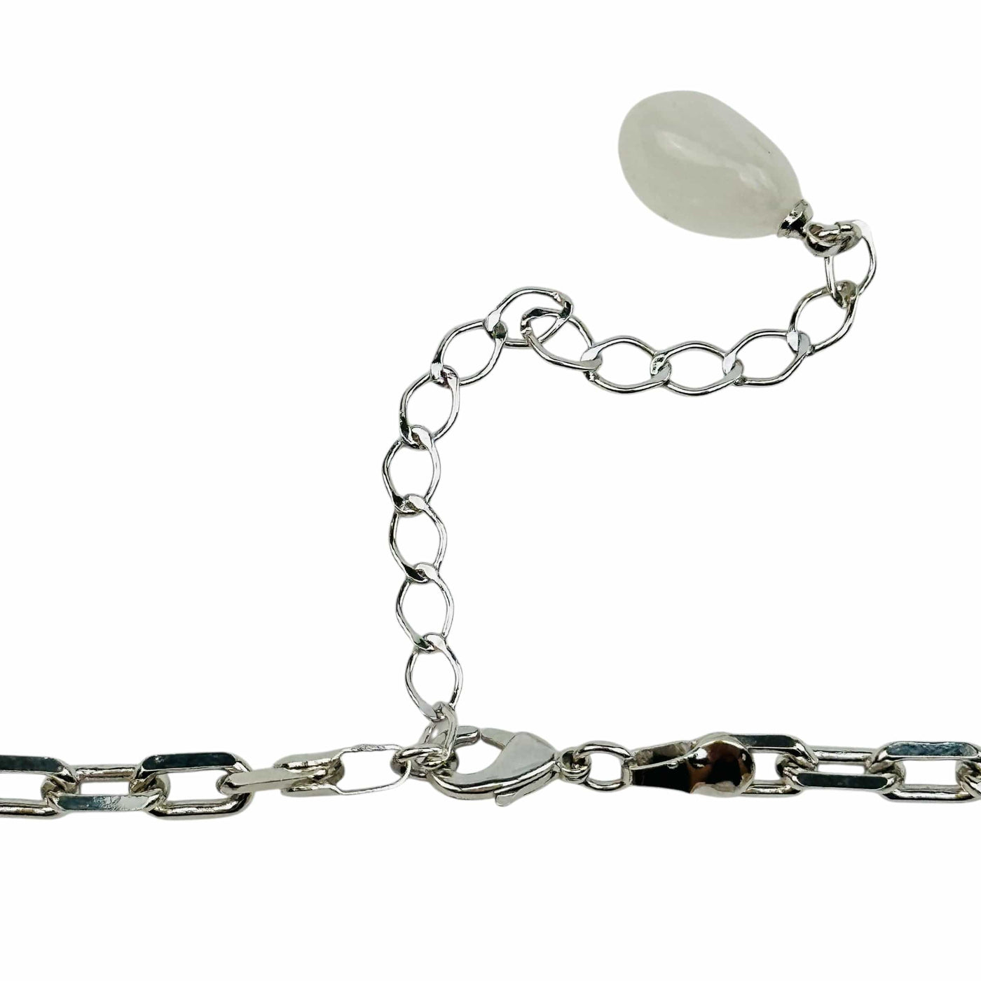 close up of the details on the necklace clasp. it has a small crystal charm on the end 